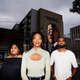 Cicley Gay, left, D’Zhane Parker, center, and Shalomyah Bowers pose for a portrait on Friday, May 13, 2022, in Atlanta.